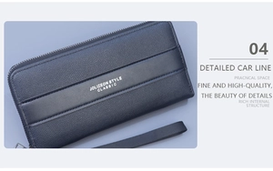 Detail view of deep blue leather wallet with palm grain texture and wrist strap