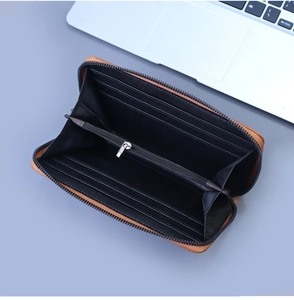 Detail of men's brown zip wallet showing multi-slot interior and spacious card organization