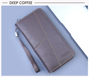 Close-up of deep coffee textured leather wallet with metal zipper and wrist strap