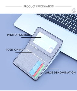 Detailed view of grey canvas wallet showing clear ID window and multi-slot card holder