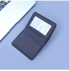 Detailed inner view of canvas wallet showing vertical card slots and a clear ID window