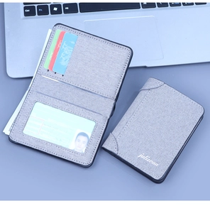 Detailed view of grey canvas wallet featuring multiple vertical card slots and ID window