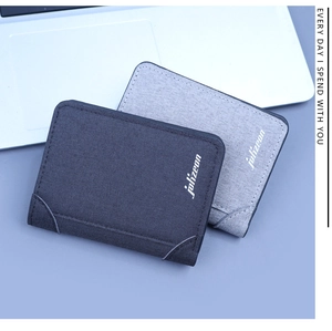 Detailed view of two slim vertical canvas wallets in dark and light grey colors