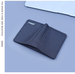 Close-up of slim canvas card holder showing fine fabric texture and neat stitching