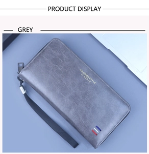 Détail du portefeuille gris vintage en cuir ciré avec logo doré et ruban tricolore