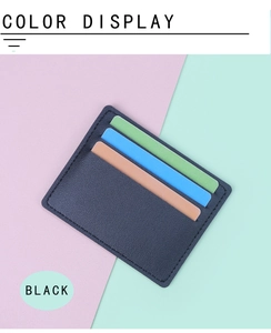 Slim black leather card holder with three slots showing green blue and brown cards