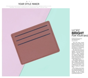 Detailed view of a slim brown leather card holder featuring three slots and precise stitching