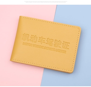 Detail of yellow lychee texture faux leather driver license holder with fine stitching