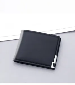 Close-up of men's black leather wallet with sleek L-shaped metal trim and card slots