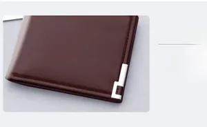 Close-up of fine stitching and silver metal corner detail on dark brown leather wallet