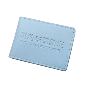 Light blue faux leather driving license cover with embossed lettering and stitching
