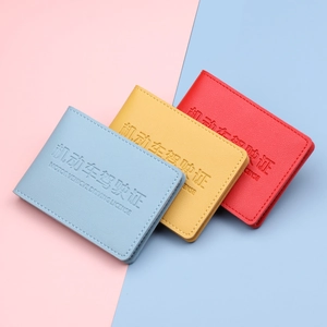 Leather driving license holders in blue, yellow and red colors with pebble texture