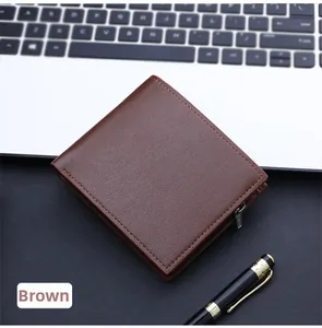 Close-up of coffee brown leather wallet with lychee texture and silver zipper detail