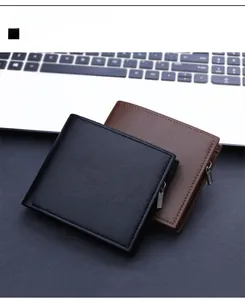 Close-up of black and brown leather wallets with zippers on a desk workspace
