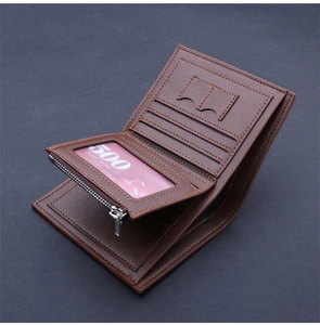 Macro detail of brown leather wallet interior showing card slots and zipper pocket