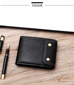 Close-up of black leather men's wallet with white stitching and bronze snap closure