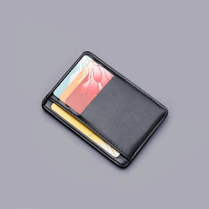 Slim minimalist black leather card holder with multiple card slots and fine stitching