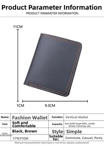 Detailed view of black textured leather vertical wallet with orange contrast stitching