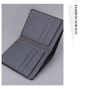 Detailed view of leather wallet interior with vertical card slots and orange stitching