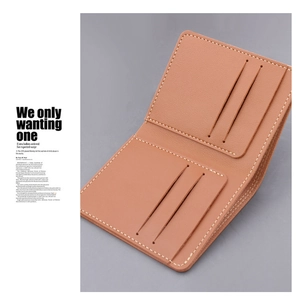 Detail view of the camel leather wallet interior with four card slots and fine stitching