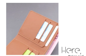 Detailed interior of slim leather wallet showing card slots and currency compartment