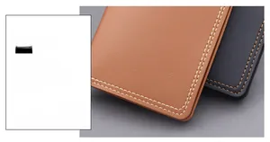 Macro detail showing brown and black lychee texture leather with white contrast stitching