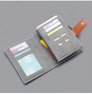 Detail view of men's short wallet showing multiple card slots and snap button strap.