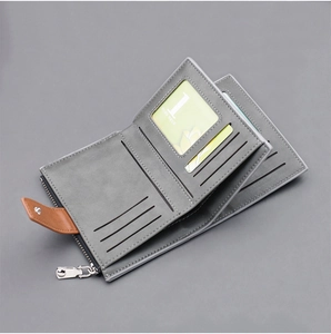 Detail of dark grey canvas wallet showing multiple card slots and a secure zipper pocket