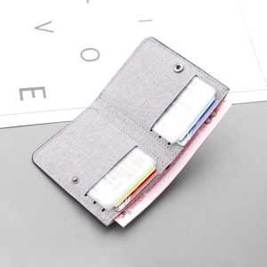 Vertical slim canvas wallet for men in grey fabric featuring multi-card slots and snap button