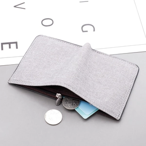 Slim grey canvas wallet for men featuring a thin profile and organized card storage
