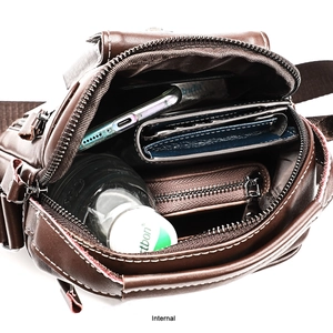 Macro view of genuine leather messenger bag interior showing spacious pockets and lining