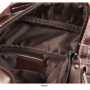 Detail view of the deep brown leather bag interior with zipper pocket and durable lining
