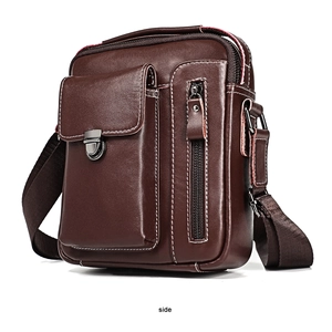 Side view of dark brown leather crossbody bag showing multiple zipper compartments