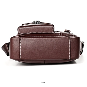 Detail view of genuine leather shoulder bag side with metal buckle and nylon strap