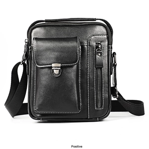 Front view of black leather shoulder bag with white stitching and metal zippers