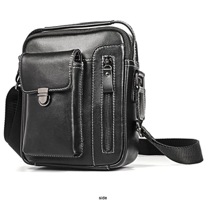 Side view of black leather crossbody bag featuring contrast stitching and metal buckle detail