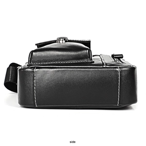 Side view of black leather shoulder bag with white contrast stitching and adjustable strap