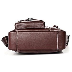 Vertical dark brown leather crossbody bag with white stitching and metal buckles