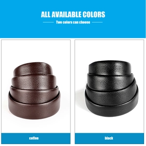 Close-up of black and coffee leather belts with lychee texture in neat rolls