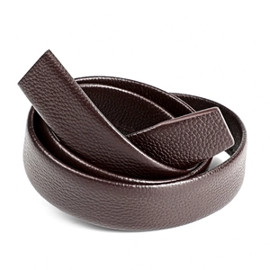Detailed macro view of dark brown litchi pattern leather belt strap in soft texture