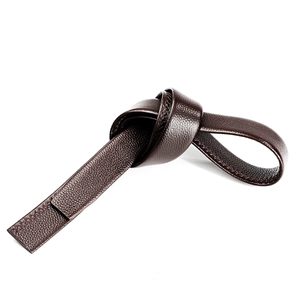 Close-up of flexible dark brown lychee grain leather belt showing soft texture and stitching