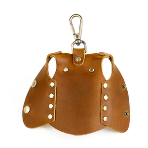 Macro view of brown leather vest-shaped key pouch with vintage metal hardware