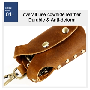 Detail view of durable brown cowhide leather key case with metal snap and swivel hook