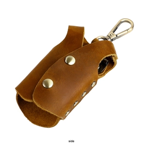 Side view of handmade brown genuine leather key pouch with silver metal spring hook