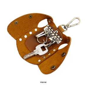 Detail of genuine leather key pouch featuring metal hooks and an internal snap closure