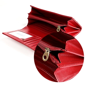 Detail of red leather wallet interior showing multiple card slots and RFID protection