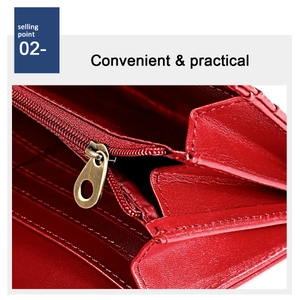 Macro shot of red leather wallet interior featuring card slots and a metal zipper compartment