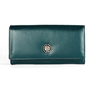 Detailed view of dark green leather wallet featuring a vintage metal rose relief emblem