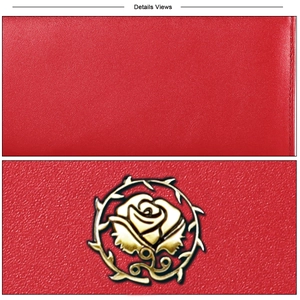 Close-up of red pebbled leather wallet with gold rose thorn emblem and fine stitching