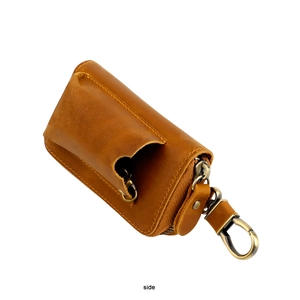 Side view of retro brown genuine leather car key holder with durable metal zipper and hook